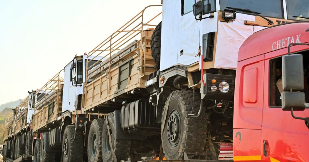 Row of trucks parked next to each other